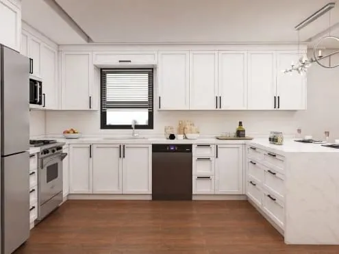 U-shaped white Shaker kitchen with a window over the sink, stainless range and a branch chandelier
