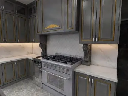 Traditional dark gray cabinets with gold trim, a stainless professional range, carved corbels and white marble counters