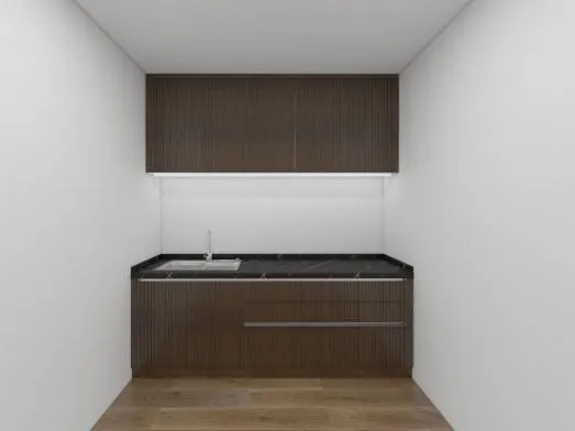 Small walnut kitchenette with fluted lower cabinets, black stone counter and a wall cabinet above