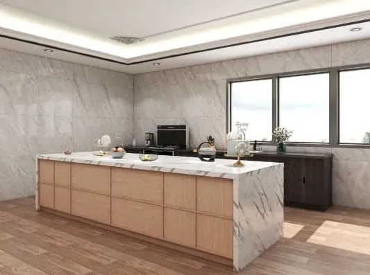 Light oak island with grid-pattern drawers and a white veined stone waterfall top beside a row of windows