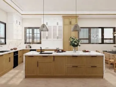 Fluted oak island with a white stone top under two glass pendants, with a dining area beyond
