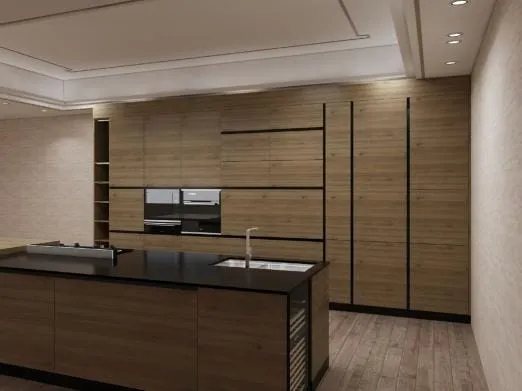 Island with a black stone top, sink and wine fridge in front of a full-height oak cabinet wall