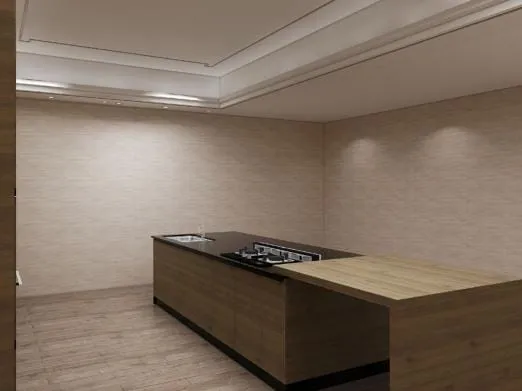 Island with a cooktop and sink and a lower wood breakfast bar under a tray ceiling