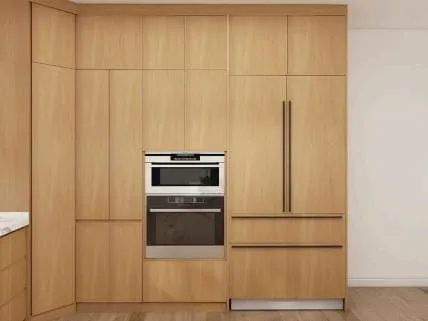 Oak tall cabinets with a built-in speed oven and wall oven beside a panel-front refrigerator
