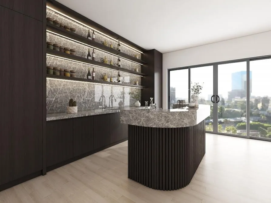 Angled view of a curved fluted island and lit shelf wall beside floor-to-ceiling glass doors