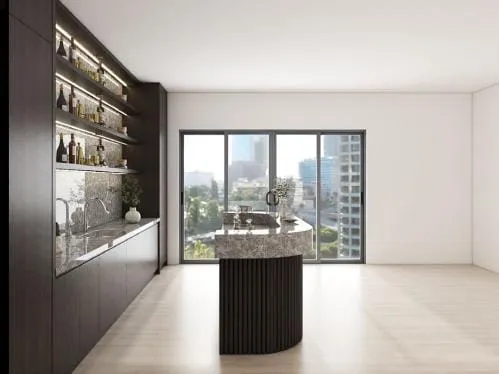 Long dark cabinet run with lit shelves and a sink, facing a curved island and a city-view window