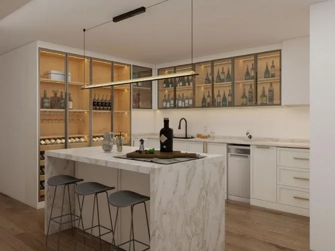 Marble island under a black linear pendant in front of lit glass-front cabinets holding wine bottles