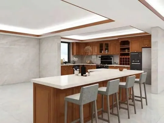 Cherry kitchen with a long white island, four upholstered stools and a tray ceiling with wood trim