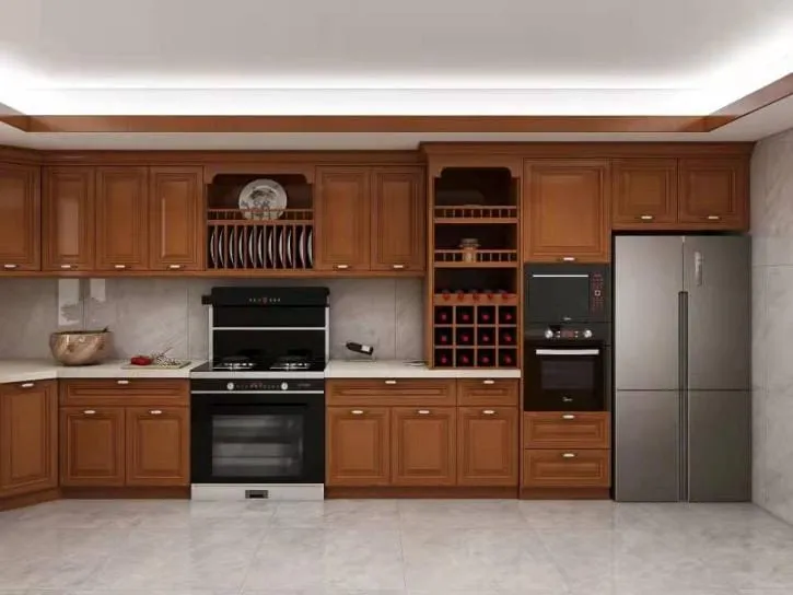 Cherry cabinet wall with a plate rack, lattice wine rack, wall ovens and a stainless refrigerator