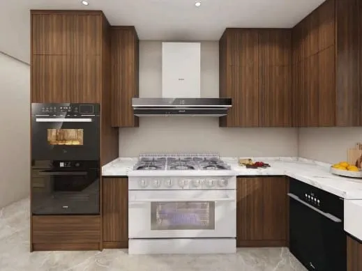 Walnut cabinets around a white range with a stainless chimney hood and black wall ovens