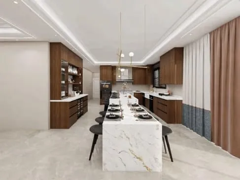 Long marble waterfall island with black stools between walnut cabinet runs under cove lighting