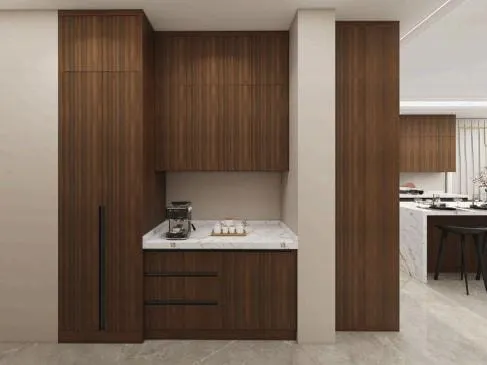 Tall walnut cabinets framing a coffee nook with a marble counter and drawers