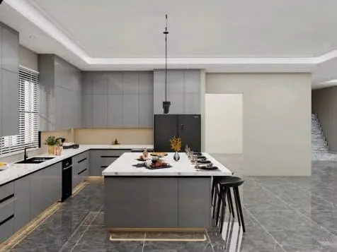 Gray gloss island with toe-kick lighting, a black refrigerator and gray stone floor tile