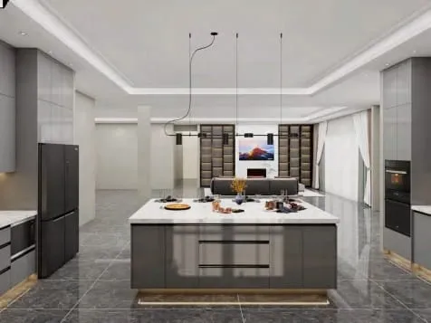 Gray island with warm under-lighting facing an open living area