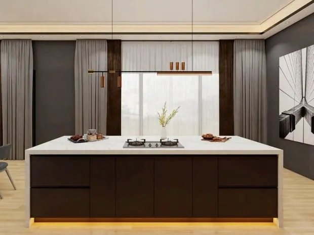 White marble island with a cooktop under a copper linear pendant, with sheer curtains behind