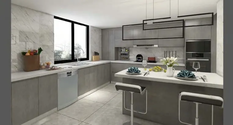 Gray kitchen with a white dining counter, two black stools and black rectangular pendants