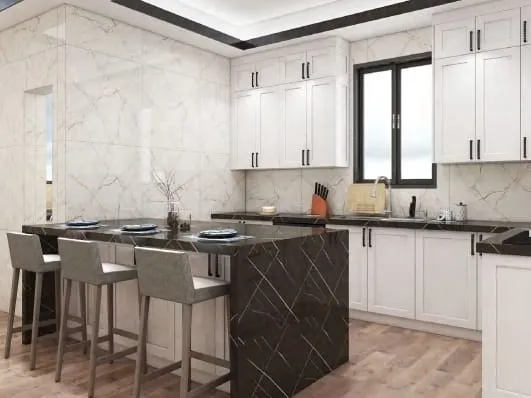 Black waterfall island with three stools in front of a white Shaker cabinet run