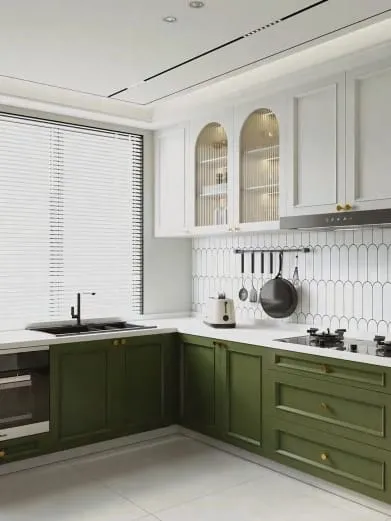 White upper cabinets with arched glass doors over olive green lowers and a hanging utensil rail