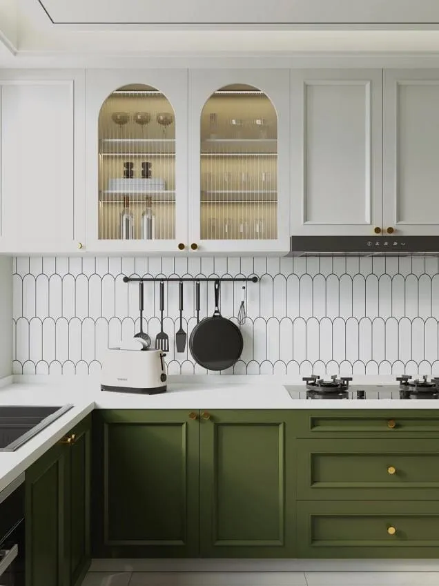 Close view of arched glass cabinet doors, picket tile and a black rail with pans