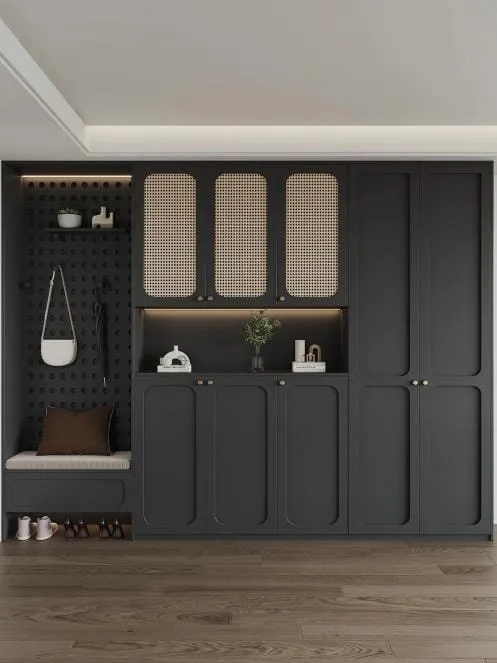 Charcoal built-in with three cane-panel doors, a lit open niche and a bench with a pillow