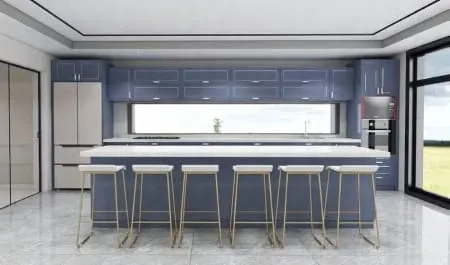 Front view of a slate blue kitchen with a white island and floor-to-ceiling glass doors