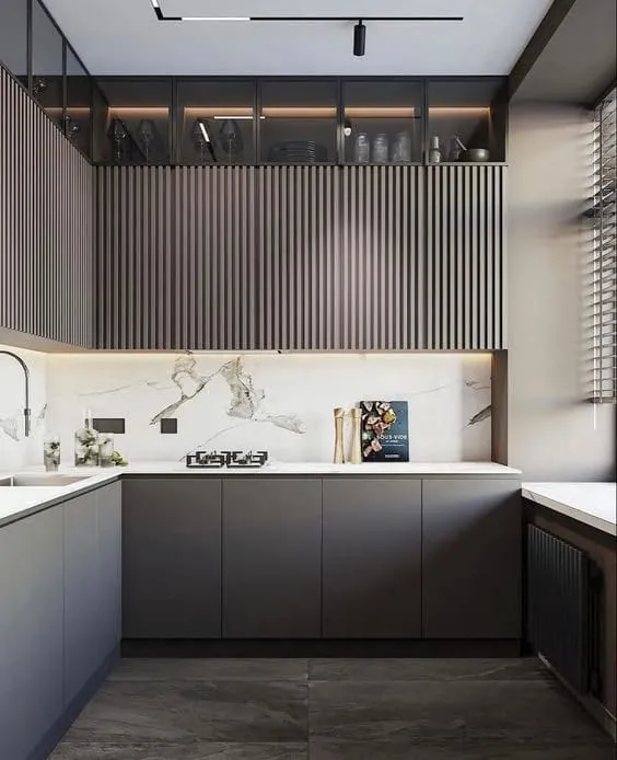 Small kitchen with charcoal lower cabinets, vertical wood slat uppers, smoked-glass cabinets and black track lights