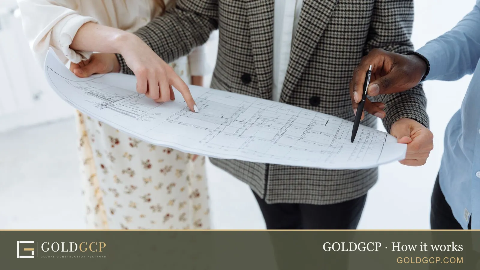 People reviewing floor plans for a building project