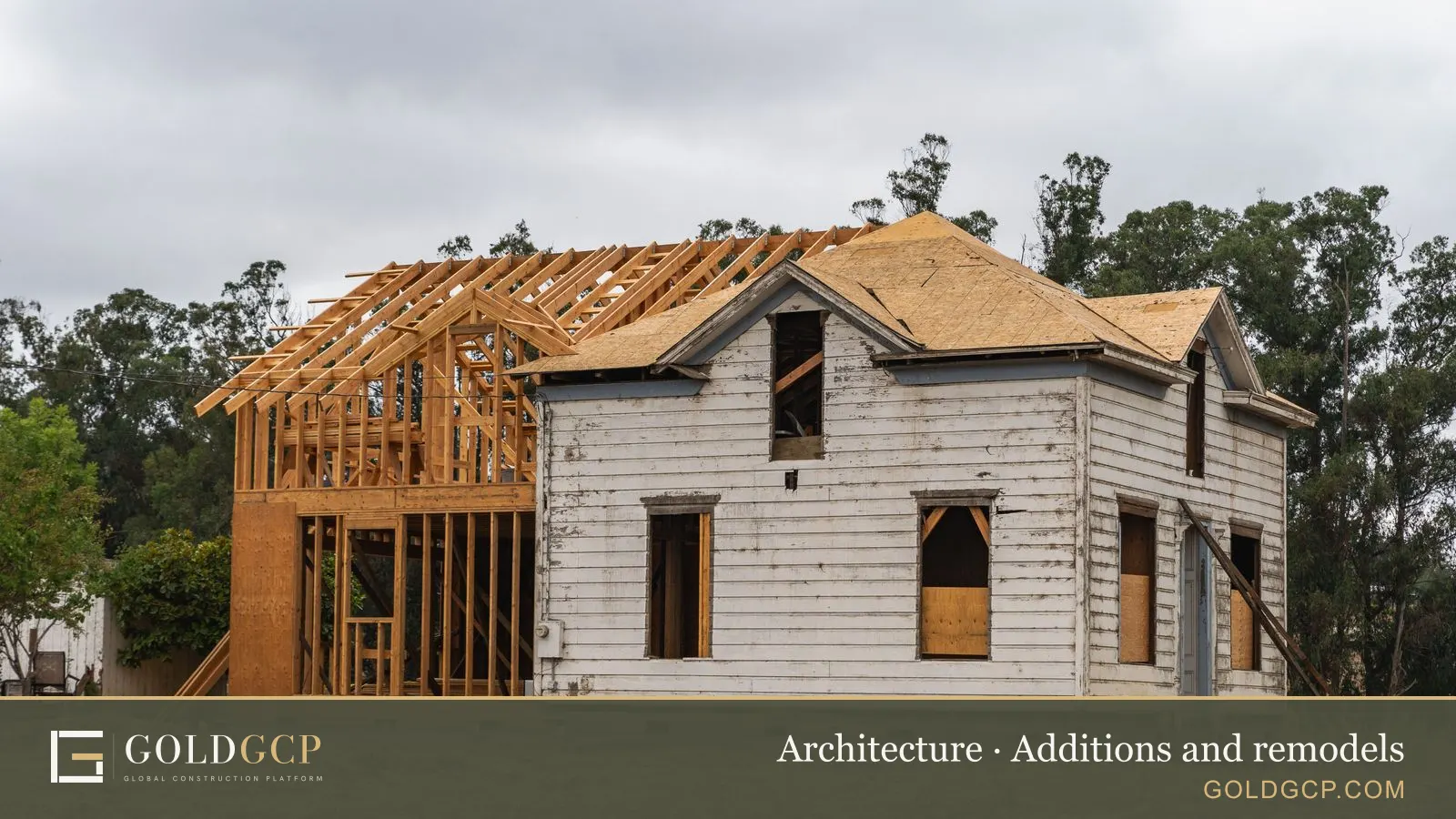 An older house under renovation with a new wood frame added