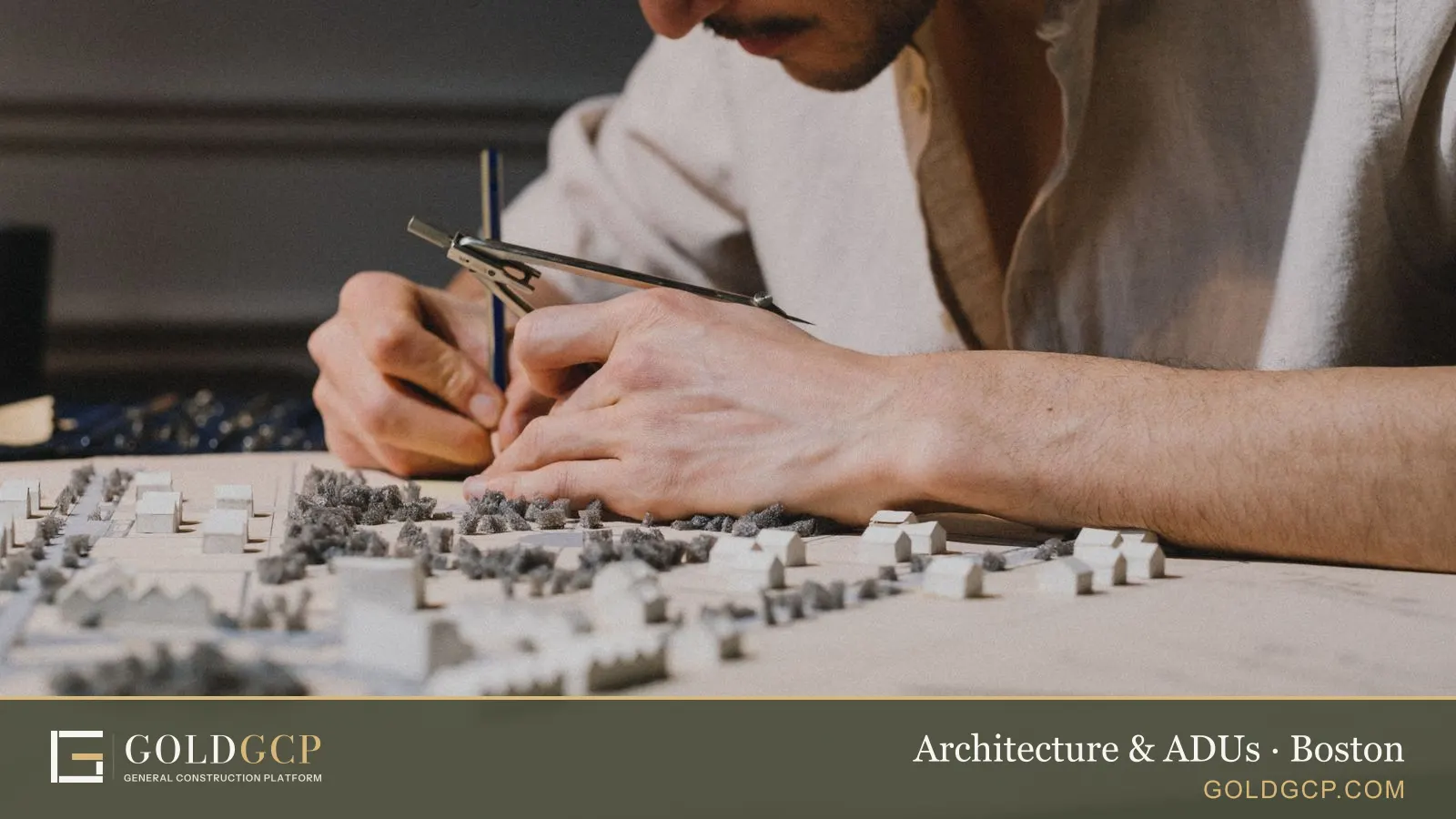 Architect using a compass to build a detailed model indoors