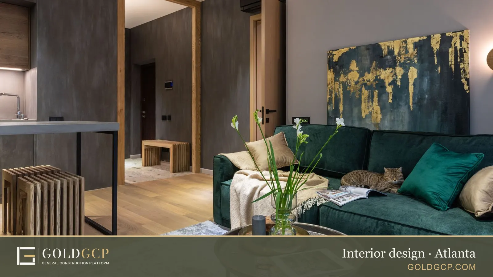 Stylish living room with a green velvet sofa, abstract art, and a cat lounging comfortably.