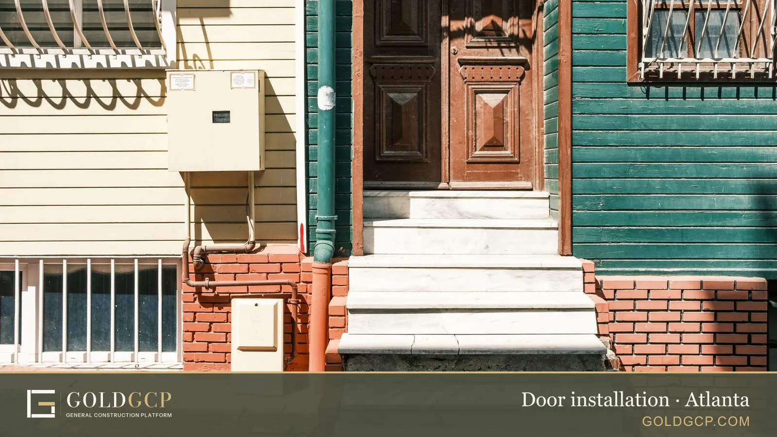 Detailed wooden door with green and yellow siding on an urban entrance