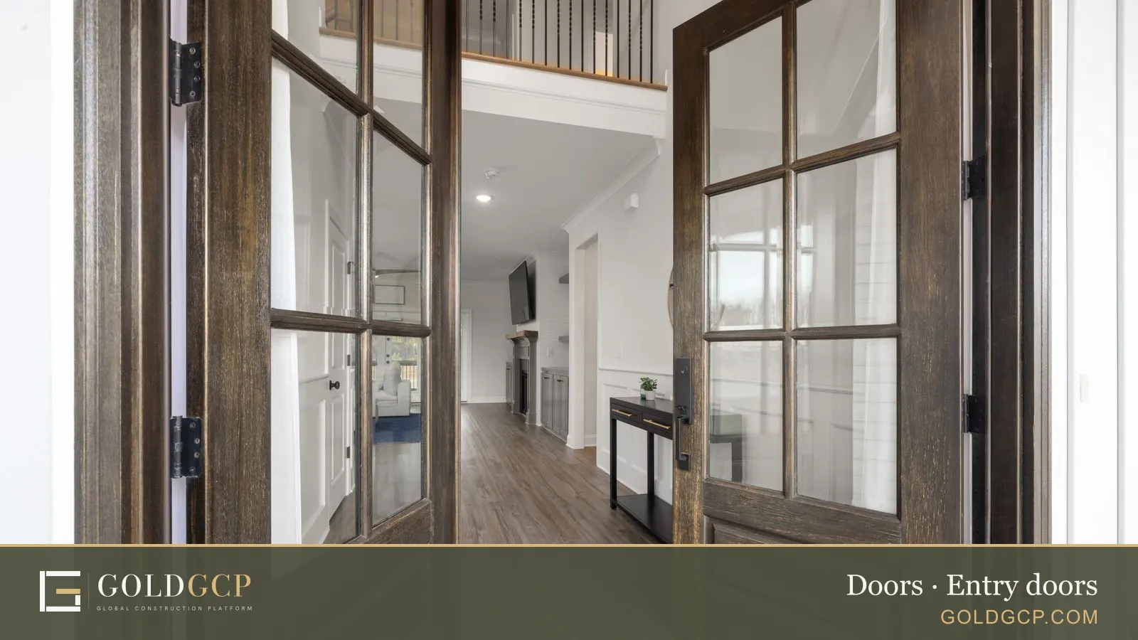 Wooden double entry doors opening into a modern home