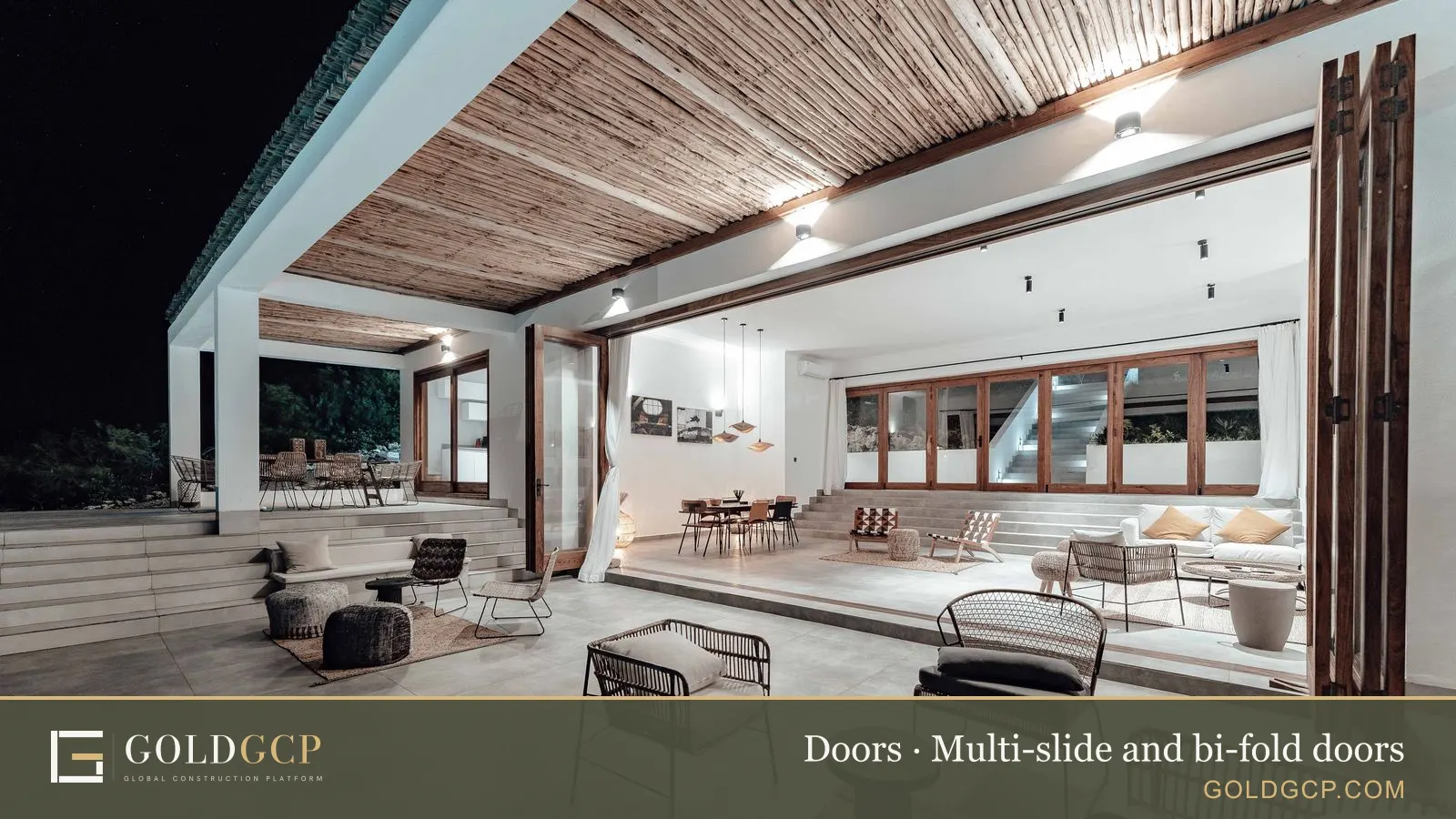 A lounge with a fully open wall joining indoor and outdoor space