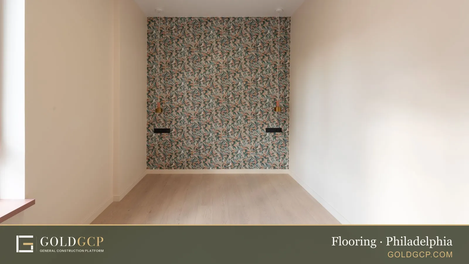 Empty spacious room with parquet floor and colorful wall with sconces in a new flat