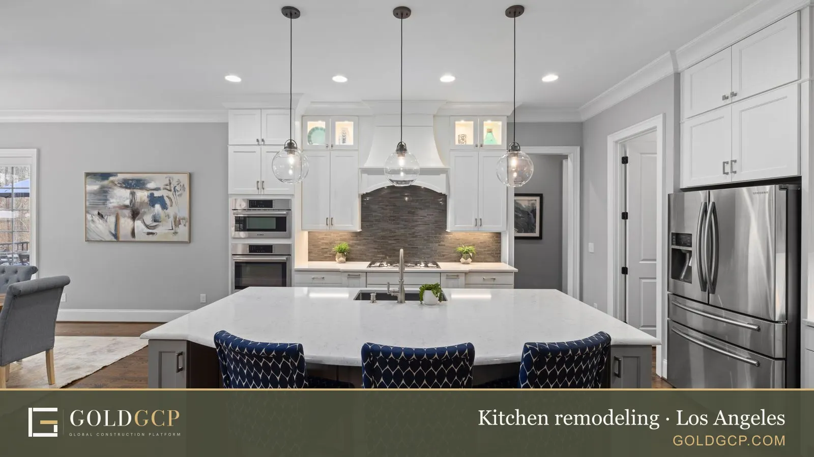 A bright kitchen with white cabinets, an island and stainless steel appliances