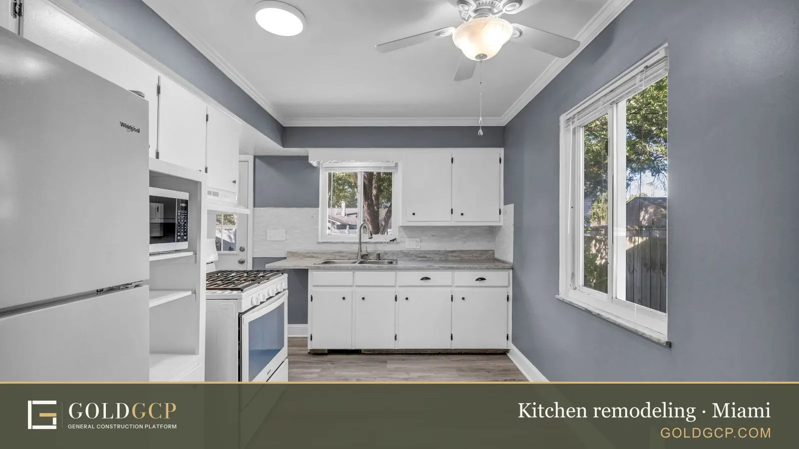 Spacious white kitchen with stylish cabinets and appliances, an inviting interior.