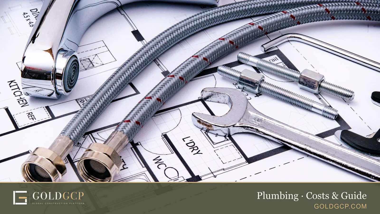 Plumbing tools and a chrome faucet lying on an architectural blueprint