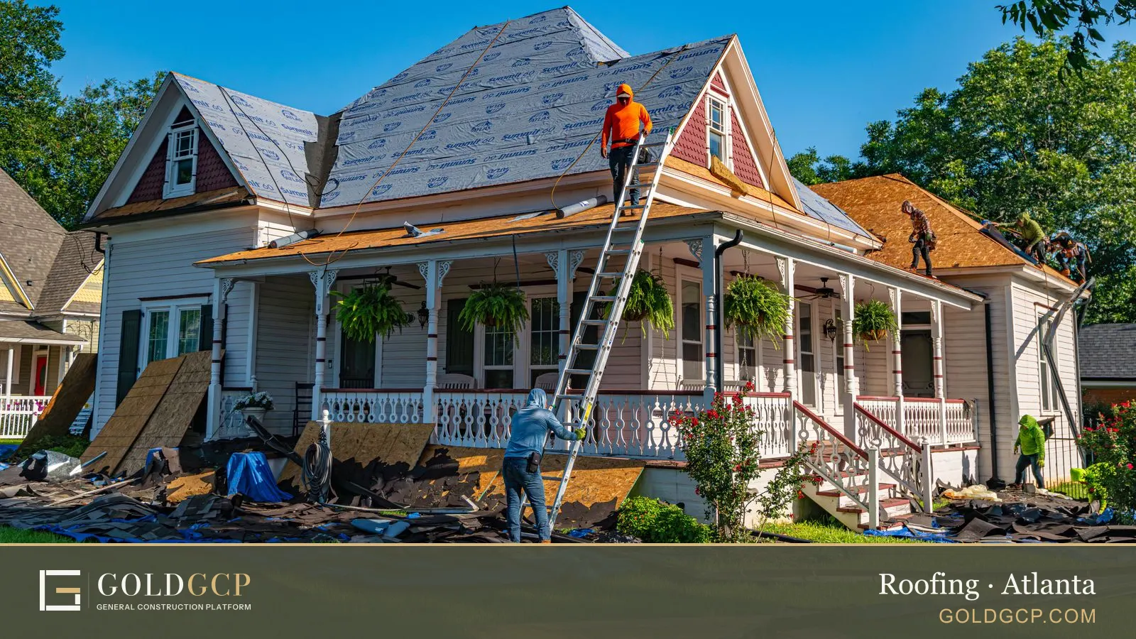 Roofers replace the roof of a historic home.