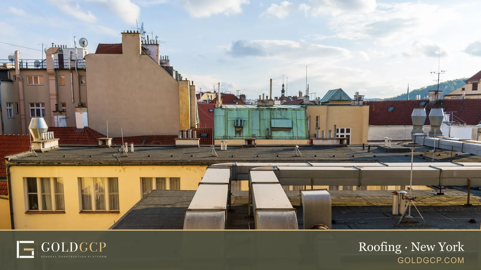 Flat and pitched rooftops across a dense city neighborhood