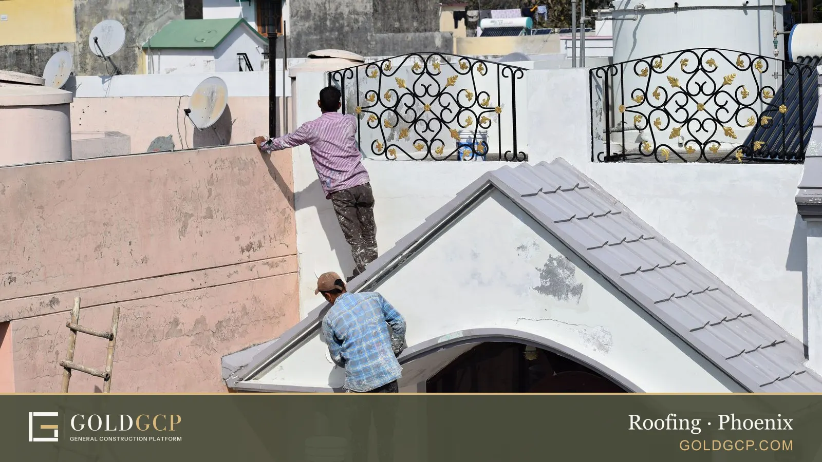 Two workers painting and renovating a building roof in a construction scene.