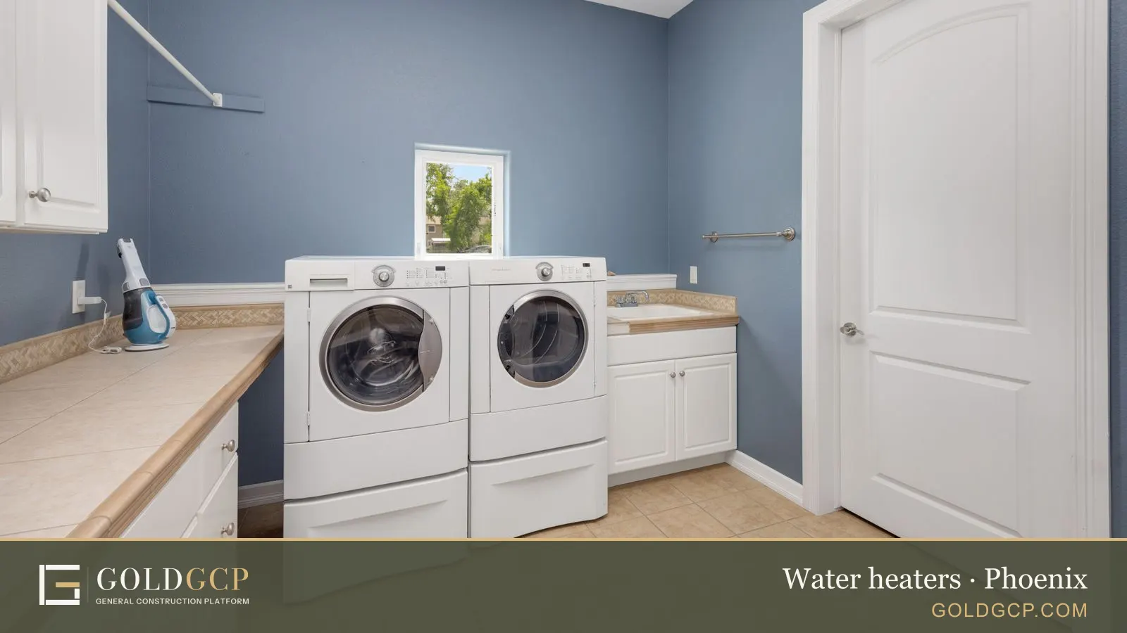 A clean laundry room with modern washing machines and storage cabinets