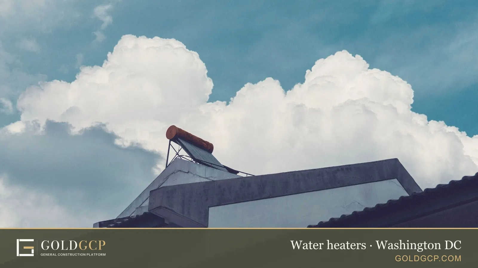 A solar water heater on a building rooftop under a cloudy sky