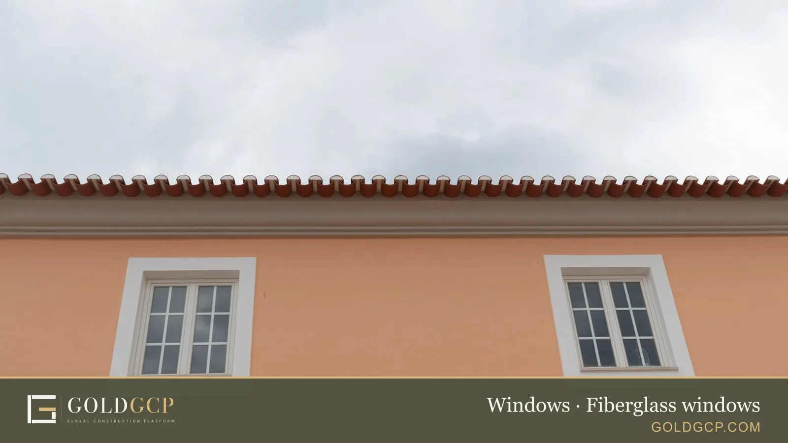Two white-framed windows on a building facade