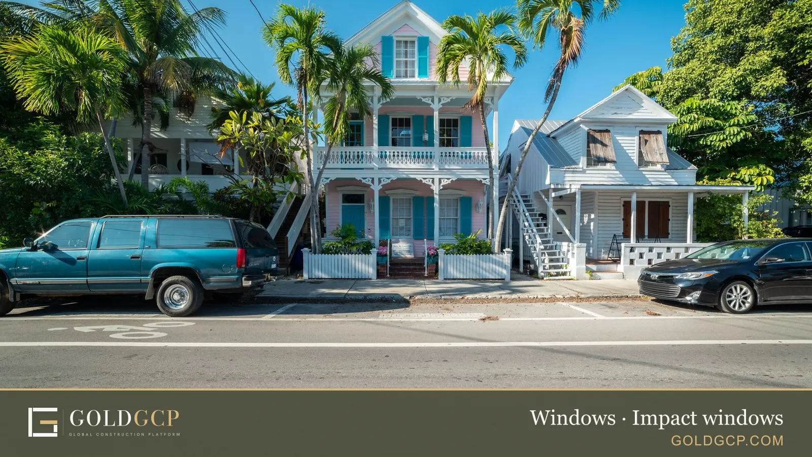Historic houses with palm trees on a sunny street in Key West, Florida