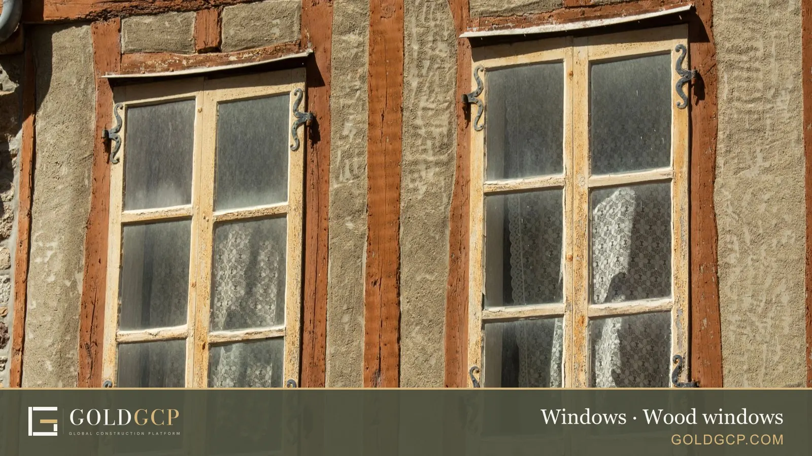 Old windows with wooden frames on a traditional facade