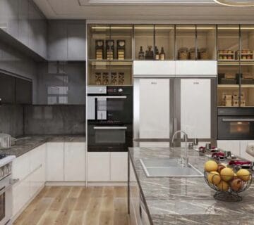 High-end Beverly Hills kitchen with marble island and gold accents.