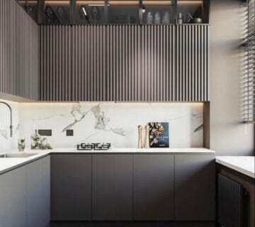 Seattle kitchen upgrade with industrial lighting and dark cabinetry.