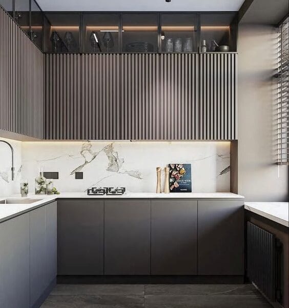 Seattle kitchen upgrade with industrial lighting and dark cabinetry.